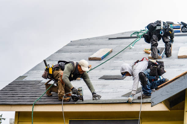 Professional Roofing technician working in Vermont, VT